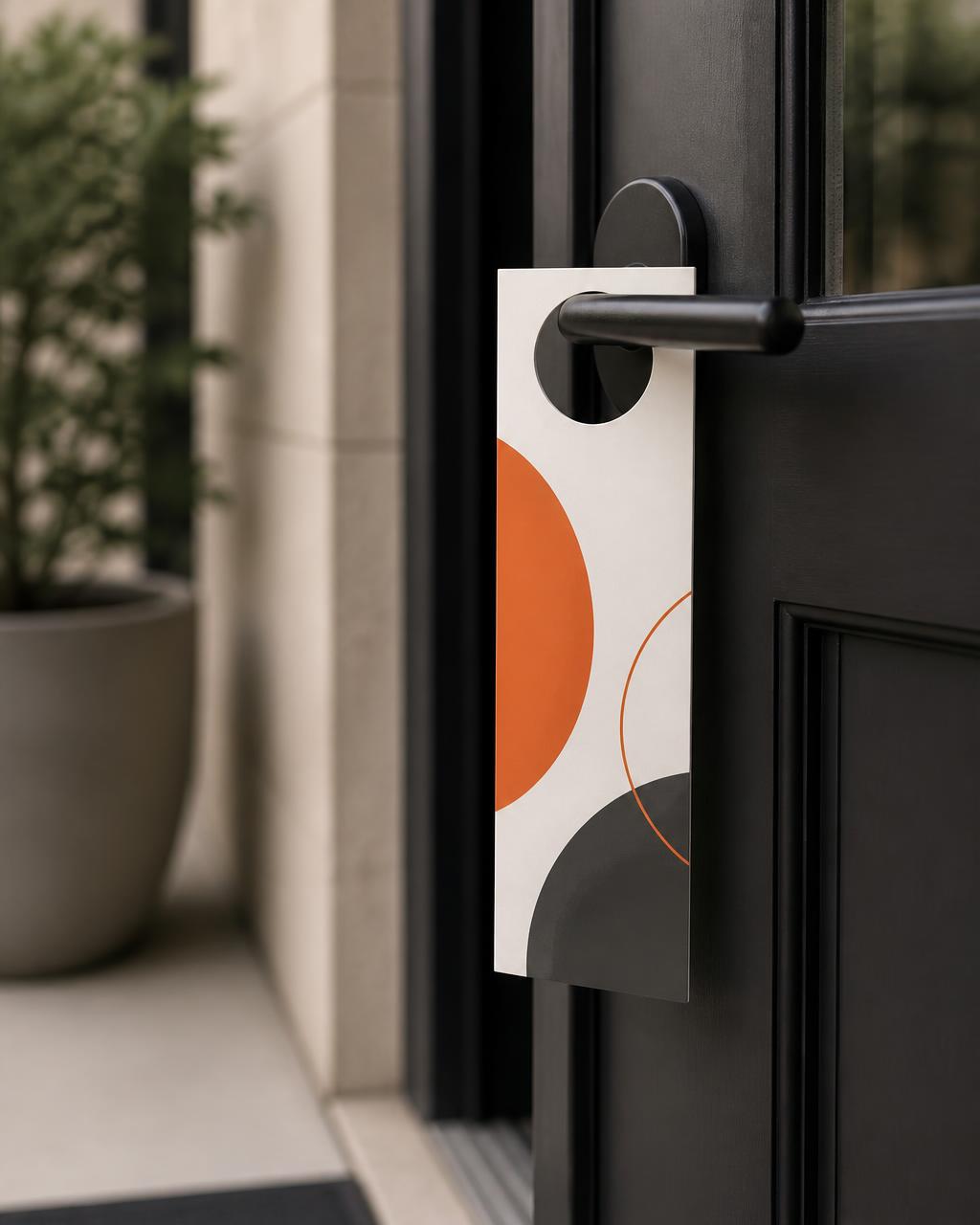 Door hanger on a dark entry door handle